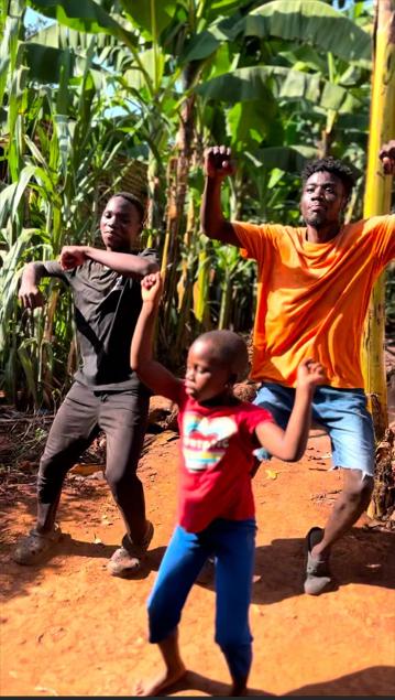 Youth dancing joyfully in Buikwe