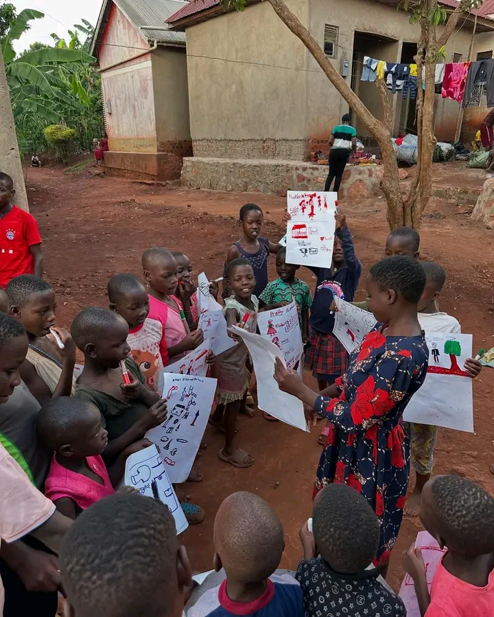 Children sharing drawings UpshiftYouthempowermentInitiative-USYEI